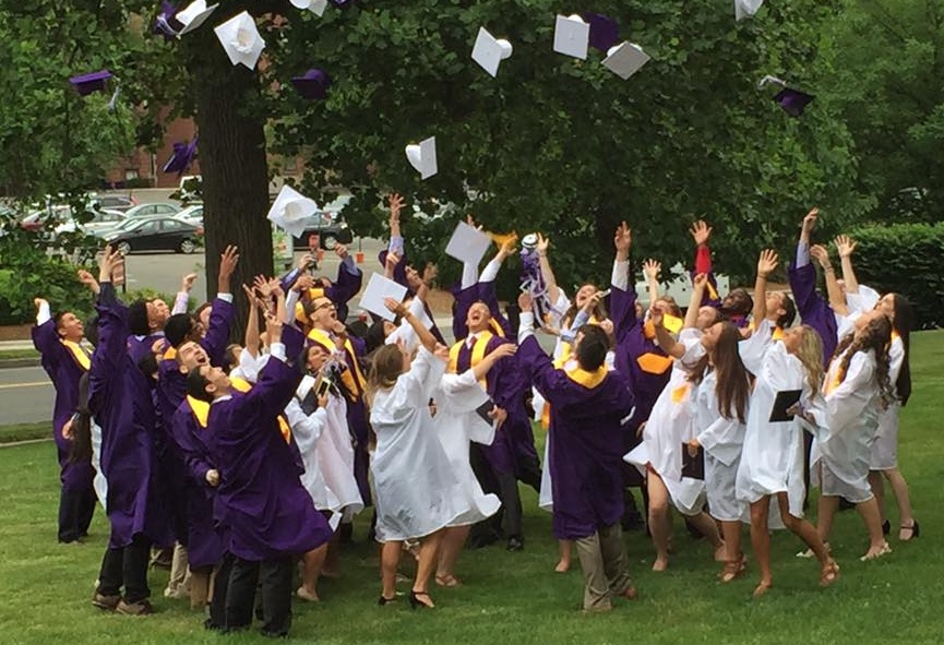 The entire Class of 2016 celebrates graduation, on the lawn of St. Michael's Cathedral.